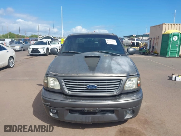 2002 Ford F-150 Harley Davidson with VIN 1FTRW07312KC88379, listed as a IAAI auction lot 41657219 with 1 mi miles. Bid and sale history available at carsss.com. Image 12.