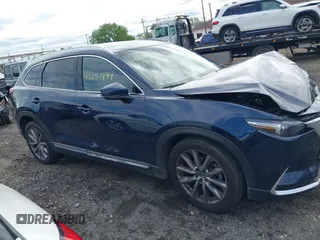 2021 Mazda CX-9 Grand Touring with VIN JM3TCBDY3M0537975, listed as a IAAI auction lot 42251894 with 50,156 mi miles and . Bid and sale history available at DreamBid. Image 13.