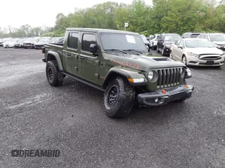 2023 Jeep Gladiator Mojave with VIN 1C6JJTEG6PL564504, listed as a IAAI auction lot 41752685 with 20,430 mi miles and . Bid and sale history available at DreamBid. Image 1.