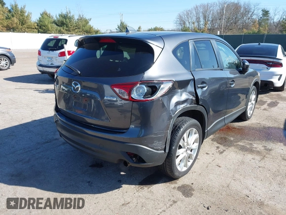 2014 Mazda CX-5 Grand Touring with VIN JM3KE4DY4E0320695, listed as a IAAI auction lot 41989350 with 169,391 mi miles and . Bid and sale history available at DreamBid. Image 4.