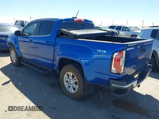 2019 GMC Canyon 4WD SLE z VIN 1GTG6CENXK1222416, wystawiony jako IAAI lot #41878077 z przebiegiem 85 415 mil mil oraz . Historia ofert i sprzedaży dostępna na DreamBid. Obrazek 3.