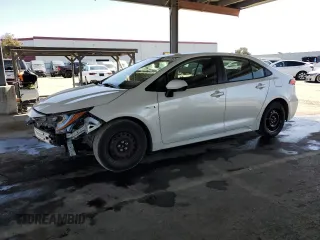 2020 Toyota Corolla Hybrid LE with VIN JTDEBRBE8LJ000680, listed as a Copart auction lot 52018565 with 57,982 mi miles and Salvage Title. Bid and sale history available at carsss.com. Image 1.