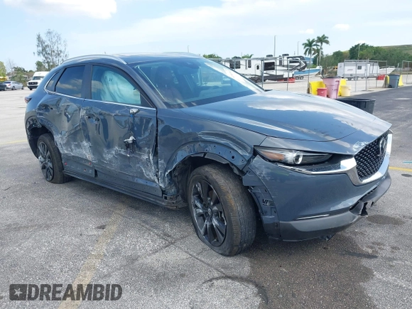 2023 Mazda CX-30 S Carbon Edition with VIN 3MVDMBCM4PM579080, listed as a IAAI auction lot 41941082 with 5,444 mi miles and . Bid and sale history available at DreamBid. Image 6.
