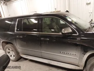 2017 Chevrolet Suburban Premier with VIN 1GNSKJKC0HR250854, listed as a IAAI auction lot 41541476 with 128,231 mi miles. Bid and sale history available at carsss.com. Image 13.