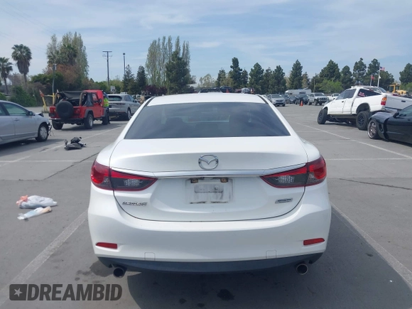 2016 Mazda Mazda6 i Touring with VIN JM1GJ1V57G1429887, listed as a IAAI auction lot 42029170 with 140,519 mi miles. Bid and sale history available at carsss.com. Image 16.