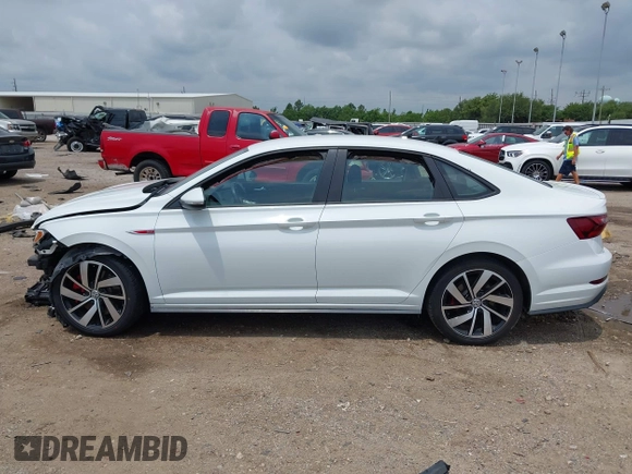 2021 Volkswagen Jetta S z VIN 3VW6T7BU2MM061165, wystawiony jako IAAI lot #42423828 z przebiegiem 41 603 mil mil oraz . Historia ofert i sprzedaży dostępna na DreamBid. Obrazek 14.
