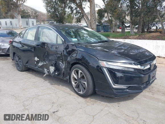 2018 Honda Clarity Plug-In Hybrid with VIN JHMZC5F10JC014054, listed as a IAAI auction lot 41932195 with 100,643 mi miles. Bid and sale history available at carsss.com. Image 1.