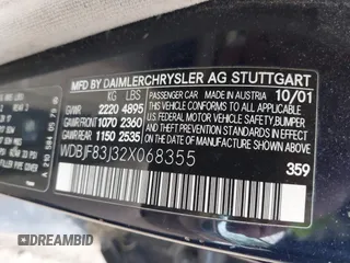 2002 Mercedes-Benz E-Class AWD with VIN WDBJF83J32X068355, listed as a IAAI auction lot 41872613 with 143,501 mi miles. Bid and sale history available at carsss.com. Image 9.