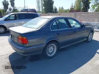 2000 BMW 5 Series 528iA with VIN WBADM634XYGU07427, listed as a IAAI auction lot 42085048 with 192,828 mi miles. Bid and sale history available at carsss.com. Image 4.