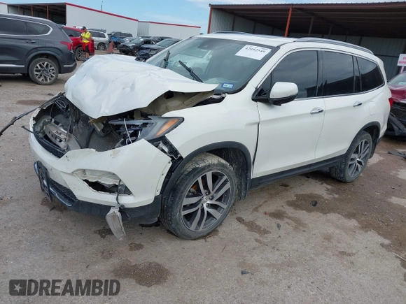 2017 Honda Pilot Touring with VIN 5FNYF6H9XHB034001, listed as a IAAI auction lot 42092549 with 142,422 mi miles and . Bid and sale history available at DreamBid. Image 2.