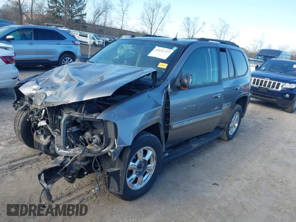 2005 GMC Envoy SLE with VIN 1GKDT13S852362380, listed as a IAAI auction lot 42031727 with 76,711 mi miles. Bid and sale history available at carsss.com. Image 18.