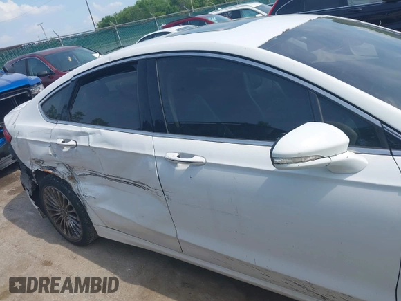 2016 Ford Fusion Titanium with VIN 3FA6P0K99GR317034, listed as a IAAI auction lot 42590288 with 200,468 mi miles and . Bid and sale history available at DreamBid. Image 13.