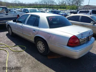 2008 Mercury Grand Marquis LS with VIN 2MEFM75V48X625878, listed as a IAAI auction lot 41874444 with 220,592 mi miles. Bid and sale history available at carsss.com. Image 3.