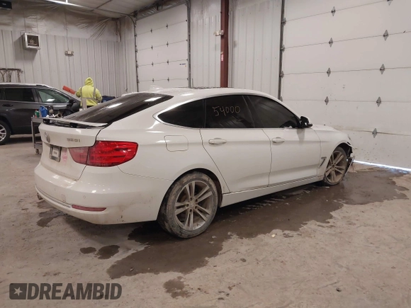 2016 BMW 3 Series GT 328i xDrive with VIN WBA8Z5C54GG500965, listed as a IAAI auction lot 41254000 with 115,672 mi miles. Bid and sale history available at carsss.com. Image 4.