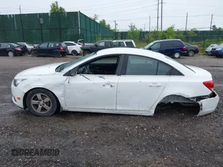 2014 Chevrolet Cruze 1LT with VIN 1G1PC5SB6E7233051, listed as a IAAI auction lot 42214334 with 88,389 mi miles and . Bid and sale history available at DreamBid. Image 14.