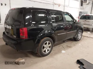 2009 Honda Pilot Touring with VIN 5FNYF48939B041166, listed as a IAAI auction lot 42098397 with 228,305 mi miles and . Bid and sale history available at carsss.com. Image 4.