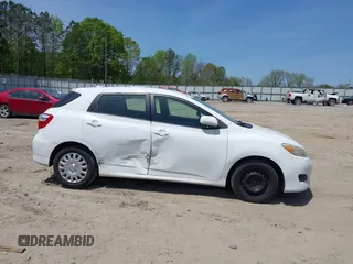 2009 Toyota Matrix with VIN 2T1KU40E39C091087, listed as a IAAI auction lot 42033558 with 338,496 mi miles. Bid and sale history available at carsss.com. Image 6.