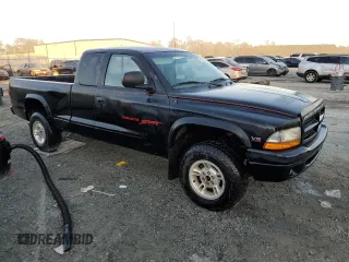 1999 Dodge Dakota SLT with VIN 1B7GG22X1XS235134, listed as a Copart auction lot 77482224 with 172,701 mi miles and Salvage Title. Bid and sale history available at carsss.com. Image 4.