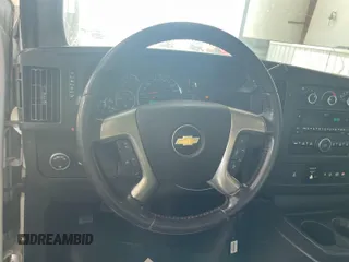 2015 Chevrolet Express Cargo with VIN 1GCWGFCF5F1172987, listed as a IAAI auction lot 42775101 with 159,466 mi miles and . Bid and sale history available at DreamBid. Image 3.