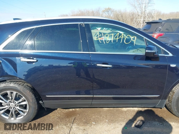 2021 Cadillac XT5 FWD Premium Luxury z VIN 1GYKNCRS2MZ141440, wystawiony jako IAAI lot #41874409 z przebiegiem 76 911 mil mil oraz . Historia ofert i sprzedaży dostępna na DreamBid. Obrazek 13.