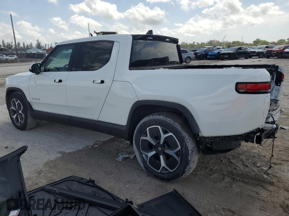 2023 Rivian R1T Adventure z VIN 7FCTGBAA5PN028668, wystawiony jako Copart lot #61126184 z przebiegiem 2337 mil mil oraz Szkody całkowita. Historia ofert i sprzedaży dostępna na DreamBid. Obrazek 2.