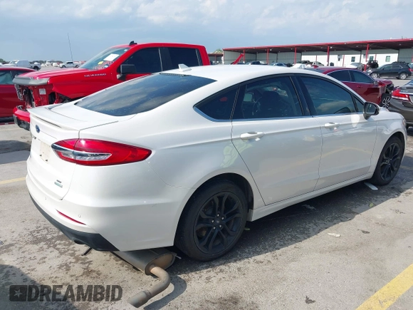 2020 Ford Fusion SE with VIN 3FA6P0HD3LR161093, listed as a IAAI auction lot 42127161 with 59,607 mi miles and . Bid and sale history available at DreamBid. Image 4.