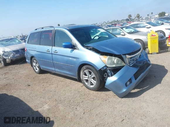 2010 Honda Odyssey Touring with VIN 5FNRL3H92AB056186, listed as a IAAI auction lot 41851386 with 199,109 mi miles. Bid and sale history available at carsss.com. Image 1.