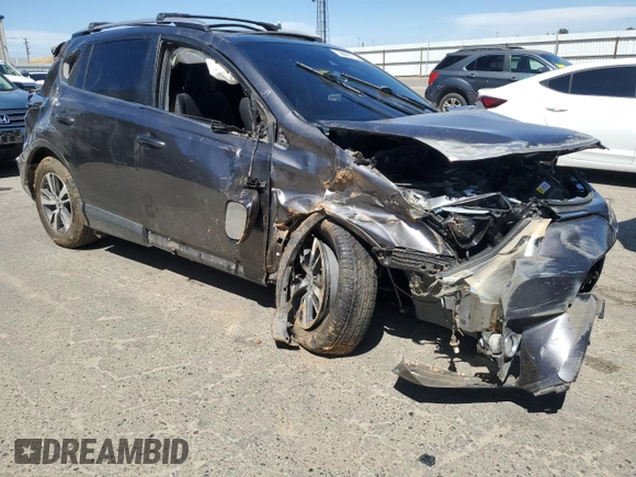 2018 Toyota RAV4 XLE with VIN JTMWFREV6JJ172451, listed as a Copart auction lot 58095775 with Not provided miles and Salvage title. Bid and sale history available at DreamBid. Image 4.