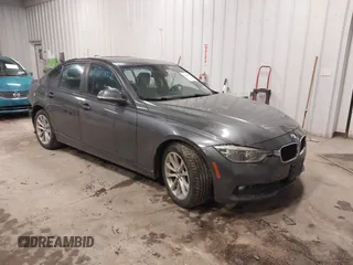 2018 BMW 3 Series 320i xDrive with VIN WBA8E5G50JNU48047, listed as a IAAI auction lot 41564022 with 69,971 mi miles. Bid and sale history available at carsss.com. Image 1.