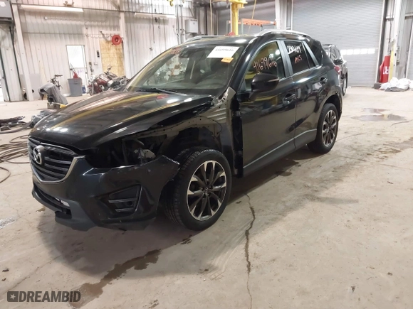 2016 Mazda CX-5 Grand Touring with VIN JM3KE2DY9G0635368, listed as a IAAI auction lot 41699616 with 240,619 mi miles. Bid and sale history available at carsss.com. Image 20.