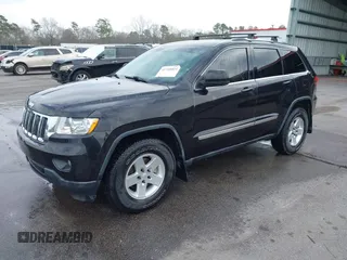 2012 Jeep Grand Cherokee Laredo with VIN 1C4RJEAG2CC259279, listed as a IAAI auction lot 41768024 with 185,161 mi miles. Bid and sale history available at carsss.com. Image 2.