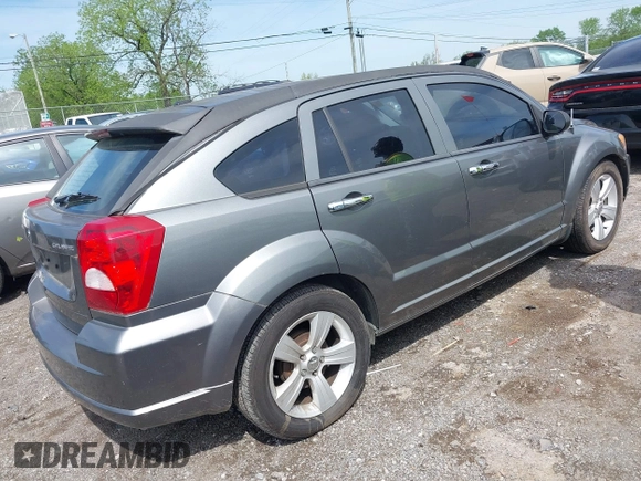 2011 Dodge Caliber Mainstreet with VIN 1B3CB3HA1BD247594, listed as a IAAI auction lot 42082305 with 122,438 mi miles. Bid and sale history available at carsss.com. Image 4.