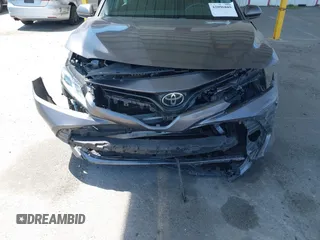 2019 Toyota Camry LE with VIN 4T1B11HK8KU204599, listed as a IAAI auction lot 42096889 with 76,518 mi miles and . Bid and sale history available at DreamBid. Image 6.