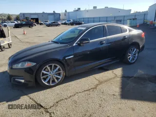 2013 Jaguar XF RWD with VIN SAJWA0E7XD8S70472, listed as a Copart auction lot 47078745 with 98,624 mi miles and Salvage Title. Bid and sale history available at DreamBid. Image 1.