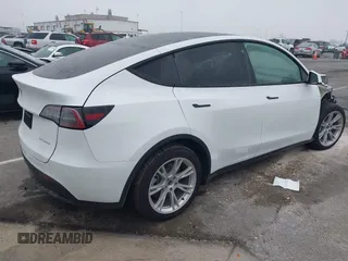 2022 Tesla Model Y Long Range z VIN 7SAYGDEE4NF315356, wystawiony jako IAAI lot #41571151 z przebiegiem 1 056 mil mil oraz . Historia ofert i sprzedaży dostępna na DreamBid. Obrazek 4.