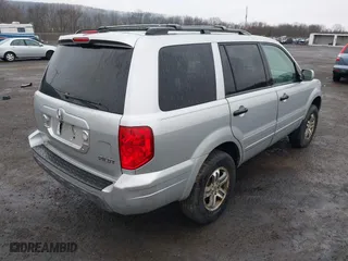 2004 Honda Pilot EX with VIN 2HKYF18534H617991, listed as a IAAI auction lot 41855906 with 193,084 mi miles. Bid and sale history available at carsss.com. Image 4.