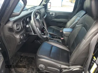 2023 Jeep Wrangler Sahara z VIN 1C4JJXP67PW513595, wystawiony jako Copart lot #53482175 z przebiegiem 30 943 mil mil oraz Szkoda całkowita • Salvage title. Historia ofert i sprzedaży dostępna na DreamBid. Obrazek 7.