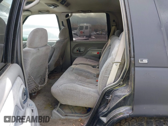 1999 Chevrolet Tahoe Z71 with VIN 1GNEK13R1XJ425996, listed as a IAAI auction lot 41798943 with 203,106 mi miles and . Bid and sale history available at DreamBid. Image 8.