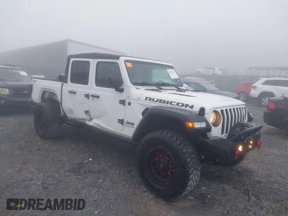 2022 Jeep Gladiator Rubicon z VIN 1C6JJTBG3NL111054, wystawiony jako IAAI lot #40793144 z przebiegiem 40 115 mil mil oraz . Historia ofert i sprzedaży dostępna na DreamBid. Obrazek 1.