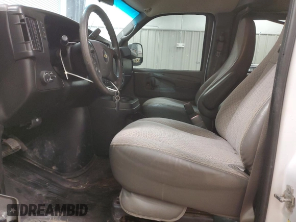 2014 Chevrolet Express Passenger LT with VIN 1GAZG1FG4E1176590, listed as a Copart auction lot 83660024 with 167,653 mi miles and Salvage title. Bid and sale history available at DreamBid. Image 7.