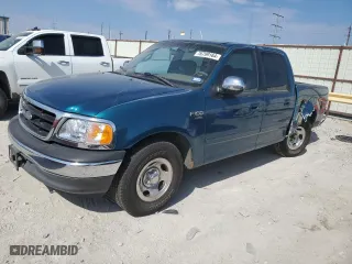 2001 Ford F-150 SuperCrew XLT with VIN 1FTRW07W61KF51152, listed as a Copart auction lot 76799164 with 154,718 mi miles and Salvage Title. Bid and sale history available at carsss.com. Image 1.