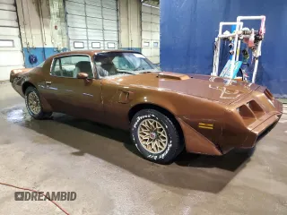 1979 Pontiac Firebird z VIN 2W87K9N184050, wystawiony jako Copart lot #75937874 z przebiegiem 18 509 mil mil oraz Szkody całkowita. Historia ofert i sprzedaży dostępna na DreamBid. Obrazek 4.