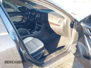 2014 Mazda 6 i Grand Touring with VIN JM1GJ1W50E1107877, listed as a IAAI auction lot 41857596 with 166,188 mi miles and . Bid and sale history available at DreamBid. Image 5.