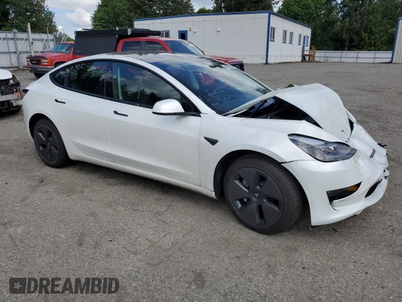 2023 Tesla Model 3 Long Range with VIN 5YJ3E1EB1PF603100, listed as a Copart auction lot 54945865 with 22,865 mi miles and Salvage Title. Bid and sale history available at DreamBid. Image 4.