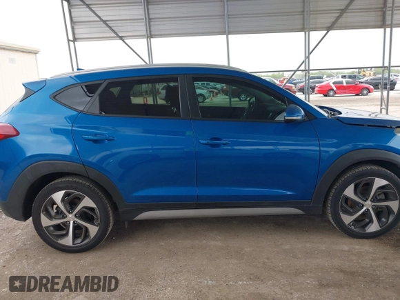 2018 Hyundai Tucson Sport with VIN KM8J33AL0JU803368, listed as a IAAI auction lot 41937235 with 64,163 mi miles and . Bid and sale history available at DreamBid. Image 14.