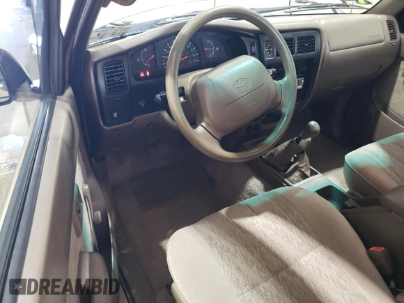 1998 Toyota Tacoma with VIN 4TAPM62N3WZ121359, listed as a Copart auction lot 63473485 with 133,472 mi miles and Salvage title. Bid and sale history available at DreamBid. Image 8.