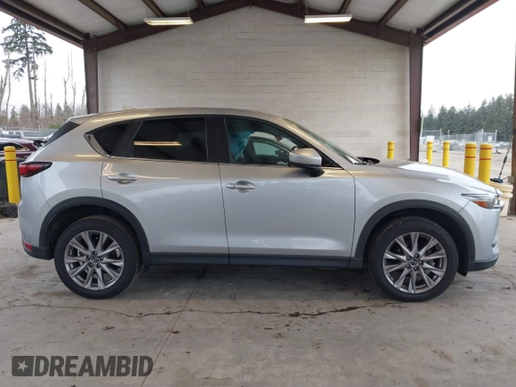 2020 Mazda CX-5 Grand Touring with VIN JM3KFADM0L0738693, listed as a IAAI auction lot 41725906 with 63,629 mi miles. Bid and sale history available at carsss.com. Image 14.