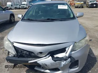 2011 Toyota Corolla L with VIN 2T1BU4EE0BC547772, listed as a IAAI auction lot 42140114 with 180,271 mi miles. Bid and sale history available at carsss.com. Image 6.