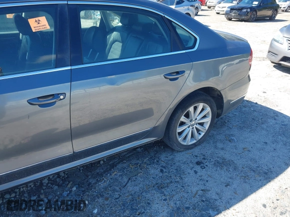 2013 Volkswagen Passat SEL Premium z VIN 1VWCP7A30DC131781, wystawiony jako IAAI lot #42193228 z przebiegiem Nie podano mil oraz . Historia ofert i sprzedaży dostępna na DreamBid. Obrazek 11.