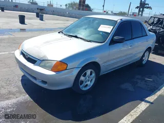 2000 Mazda Protege ES with VIN JM1BJ2218Y0283251, listed as a IAAI auction lot 41665289 with 141,336 mi miles. Bid and sale history available at carsss.com. Image 17.